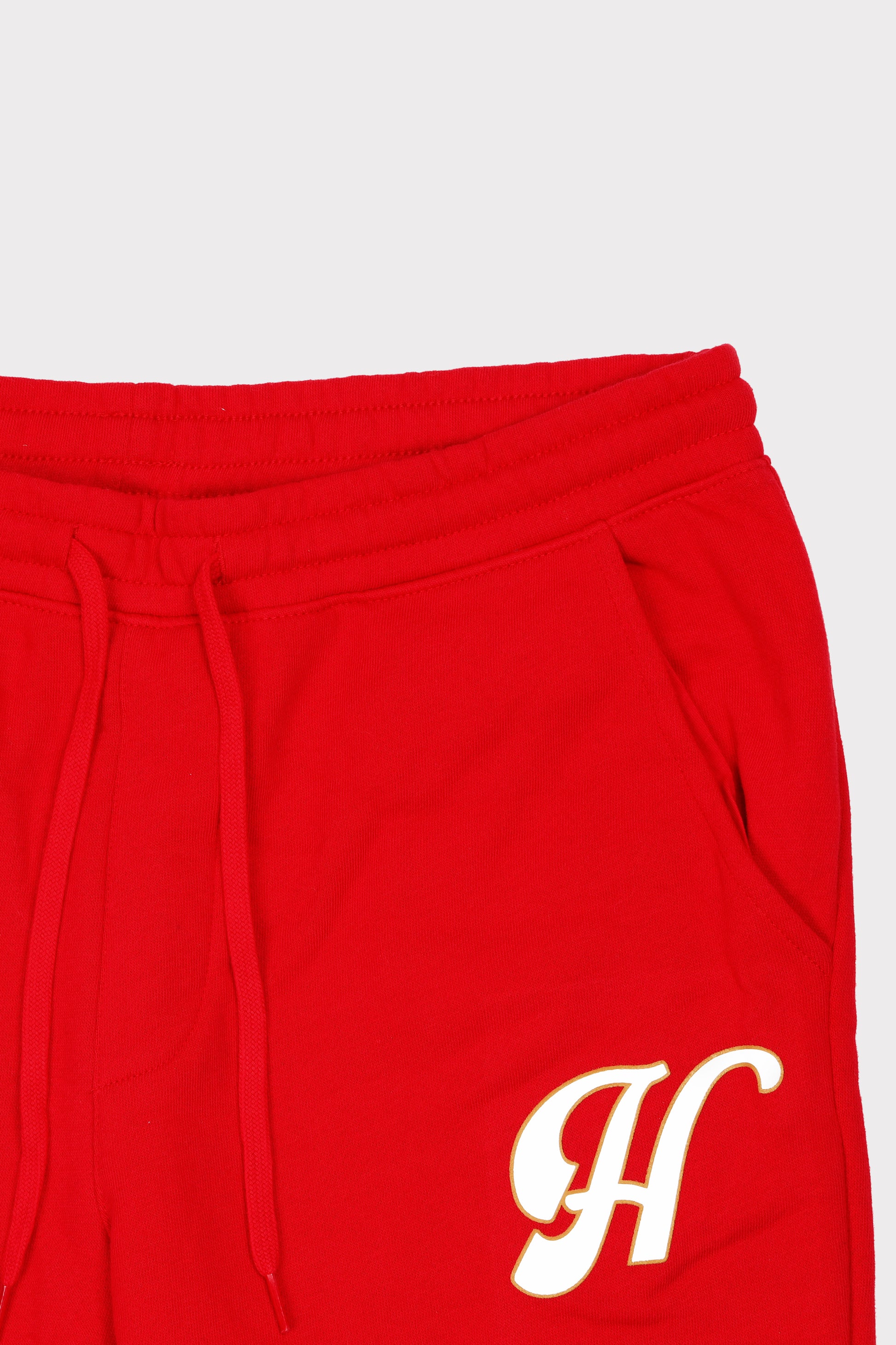 humo red joggers H logo close up